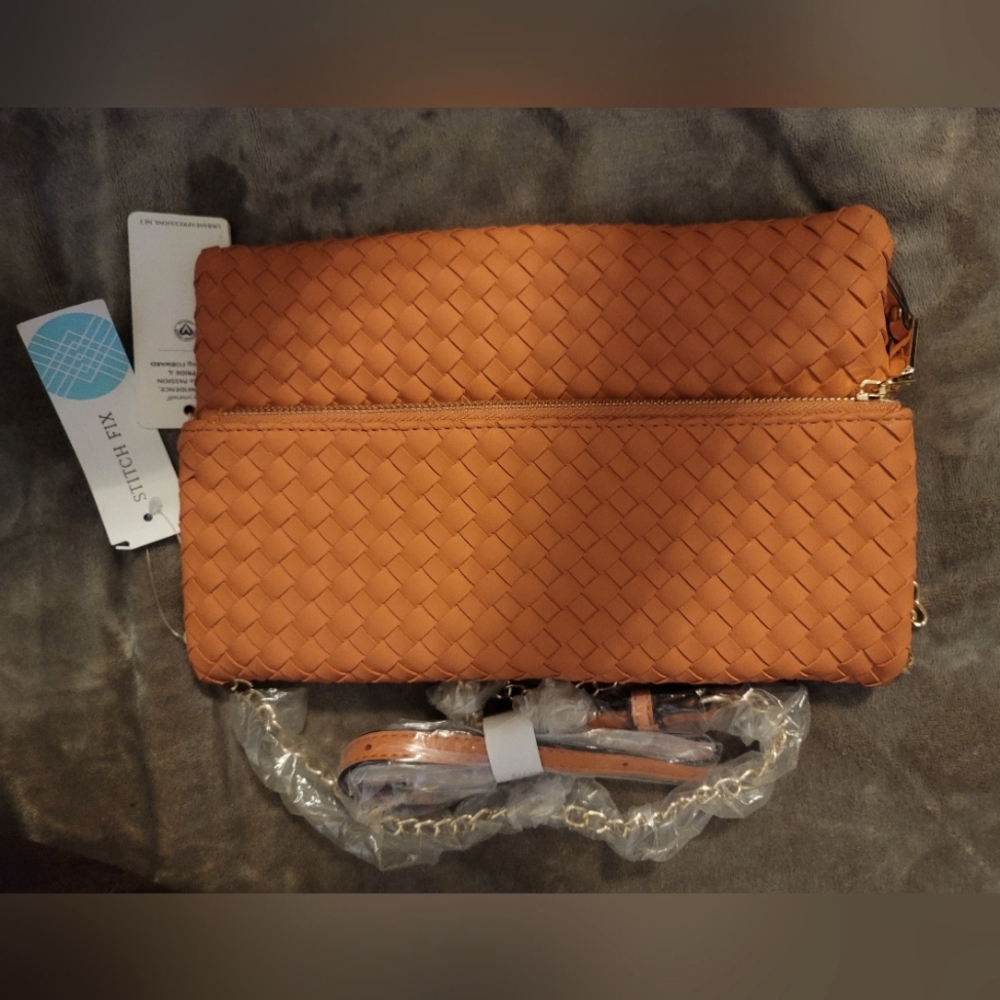 NWT. Coral crossbody bag with gold strap.